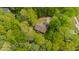 A high view showcases the property's layout within a dense tree canopy at 3428 Hardwood Dr, Apex, NC 27539