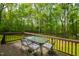 Deck boasting beautiful views of a lush, green backyard and surrounding trees at 3428 Hardwood Dr, Apex, NC 27539