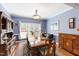 Well-lit dining room with a wood table, chairs, and a large china cabinet at 3428 Hardwood Dr, Apex, NC 27539