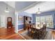 Formal dining room with wood table, six chairs, and large window providing natural light at 3428 Hardwood Dr, Apex, NC 27539
