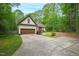 Charming home with mature trees, landscaping, and a two-car garage at 3428 Hardwood Dr, Apex, NC 27539
