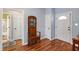 A foyer featuring hardwood floors and a decorative hall tree with coat hooks at 3428 Hardwood Dr, Apex, NC 27539