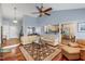 Spacious living room showcasing hardwood floors and an open concept design to the kitchen at 3428 Hardwood Dr, Apex, NC 27539