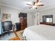 Spacious bedroom featuring hardwood floors, a large bed, and ample closet space at 3428 Hardwood Dr, Apex, NC 27539