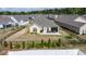 Aerial view of a home with a spacious backyard, patio and built in outdoor kitchen at 37 Blue Spruce Cir, Clayton, NC 27527