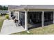 View of backyard with patio, built-in grill and cooking area, with access to a screened porch at 37 Blue Spruce Cir, Clayton, NC 27527