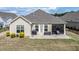Aerial view of the backyard featuring a patio, a built-in cooking area, and a screened in porch at 37 Blue Spruce Cir, Clayton, NC 27527