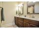 Bathroom features double sinks, dark wood cabinets, and tile flooring at 37 Blue Spruce Cir, Clayton, NC 27527