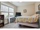 Bedroom featuring a queen bed and a window at 37 Blue Spruce Cir, Clayton, NC 27527