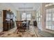 Bright dining room with hardwood floors and large windows at 37 Blue Spruce Cir, Clayton, NC 27527