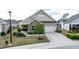Charming one-story home with a stone facade, two-car garage, and well-maintained landscaping at 37 Blue Spruce Cir, Clayton, NC 27527