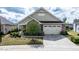 Charming one-story home with a stone facade, two-car garage, and well-maintained landscaping at 37 Blue Spruce Cir, Clayton, NC 27527
