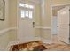 Bright foyer with a white front door, decorative rug, and access to other rooms at 37 Blue Spruce Cir, Clayton, NC 27527
