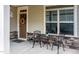 Charming front porch with seating, front door with wreath, and stone accents at 37 Blue Spruce Cir, Clayton, NC 27527