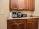 Kitchen nook featuring granite countertops, wooden cabinets and small appliances at 37 Blue Spruce Cir, Clayton, NC 27527