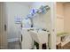 Laundry room featuring a white washer and dryer, sink, shelving and storage cubbies at 37 Blue Spruce Cir, Clayton, NC 27527