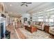 Cozy living room with hardwood floors, fireplace, and large windows at 37 Blue Spruce Cir, Clayton, NC 27527