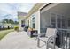 View of patio with chairs and cooking area, next to the screened in porch at 37 Blue Spruce Cir, Clayton, NC 27527