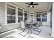 Outdoor patio seating area featuring a patio table, ceiling fan, and neutral walls at 37 Blue Spruce Cir, Clayton, NC 27527