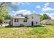 View of the backyard and back of the house from ground level at 3713 Arrowwood Dr, Raleigh, NC 27604