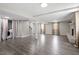 Basement featuring hardwood flooring, neutral paint, and finished laundry area at 3713 Arrowwood Dr, Raleigh, NC 27604