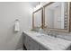 Stylish bathroom featuring double sinks with marble countertops and modern fixtures at 3713 Arrowwood Dr, Raleigh, NC 27604