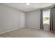 Neutral bedroom with carpeted floors and lots of natural light at 3713 Arrowwood Dr, Raleigh, NC 27604