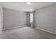 Neutral bedroom with carpeted floors and lots of natural light at 3713 Arrowwood Dr, Raleigh, NC 27604