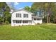Beautiful home with a well-maintained lawn, complemented by the lush green trees at 3713 Arrowwood Dr, Raleigh, NC 27604