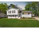 Charming two-story home with landscaped yard and blue front door at 3713 Arrowwood Dr, Raleigh, NC 27604