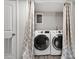 Laundry room with a side-by-side washer and dryer, and cute curtains at 3713 Arrowwood Dr, Raleigh, NC 27604