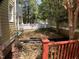 A spacious backyard showcasing a well-maintained lawn with a classic white picket fence at 409 Parkside Cir, Chapel Hill, NC 27516