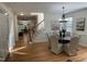 Inviting dining area with hardwood floors and stylish lighting, connecting seamlessly to other living spaces at 409 Parkside Cir, Chapel Hill, NC 27516