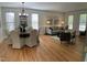 Bright dining and living areas featuring hardwood floors, large windows and a cozy seating area at 409 Parkside Cir, Chapel Hill, NC 27516