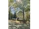 Attractive two-story home with manicured lawn, large trees, and street view at 409 Parkside Cir, Chapel Hill, NC 27516