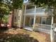 Charming home exterior featuring a red brick chimney, decks, and well-manicured landscaping at 409 Parkside Cir, Chapel Hill, NC 27516