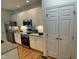 Beautiful kitchen offers modern appliances, ample cabinet space, and granite countertops with a view of the pantry at 409 Parkside Cir, Chapel Hill, NC 27516