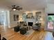 Inviting living room featuring a fireplace, hardwood floors, and comfortable seating, with a neutral color scheme at 409 Parkside Cir, Chapel Hill, NC 27516