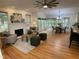 Open-concept living space with hardwood floors, a fireplace, and seamless flow to the kitchen and dining areas at 409 Parkside Cir, Chapel Hill, NC 27516
