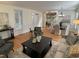 Open-concept living area with hardwood floors, neutral tones, and seamless transition to the dining space at 409 Parkside Cir, Chapel Hill, NC 27516