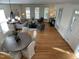 An open-concept living and dining area features hardwood floors, and abundant natural light at 409 Parkside Cir, Chapel Hill, NC 27516