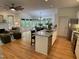 Spacious open-concept living space connects the kitchen with an island, dining area, and comfortable living room at 409 Parkside Cir, Chapel Hill, NC 27516