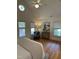 Bright and open main bedroom features a chair and vaulted ceilings with windows at 409 Parkside Cir, Chapel Hill, NC 27516