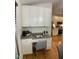 Cozy built-in office nook with granite countertop, cabinets, and drawers, ideal for remote work at 409 Parkside Cir, Chapel Hill, NC 27516