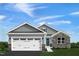 Charming single-Gathering home with stone accents, a two-car garage, and a well-manicured lawn at 42 Saintsbury Dr, Fuquay Varina, NC 27526