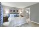 Serene main bedroom with soft lighting, neutral tones, and a view into the ensuite bathroom at 42 Saintsbury Dr, Fuquay Varina, NC 27526