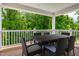 Inviting outdoor dining area with a black wicker table and chairs, perfect for enjoying meals with a view at 42 Saintsbury Dr, Fuquay Varina, NC 27526