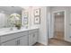 Modern bathroom boasts double sinks, granite countertops, modern fixtures, and ample vanity storage at 487 Lochalsh Dr, Gibsonville, NC 27249