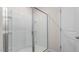 Modern bathroom with a glass-enclosed shower, white tile, and sleek fixtures at 487 Lochalsh Dr, Gibsonville, NC 27249
