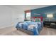 Bedroom with large window, grey bed with blue quilt, decorative pillows, and airplane decor at 487 Lochalsh Dr, Gibsonville, NC 27249